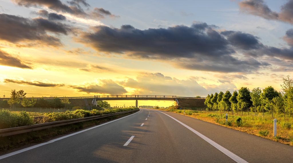A clear open highway leading to the horizon, symbolizing clarity and technology leadership.